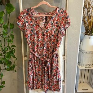 Pink/red/blue floral American eagle romper with cinched tie waist and open back
